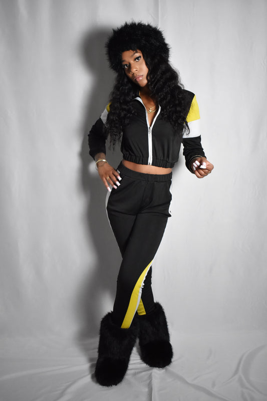 Black retro y2k tracksuit color block with yellow and white accents, brown faux fur boots, brown jumbo faux fur headband, two piece outfit set